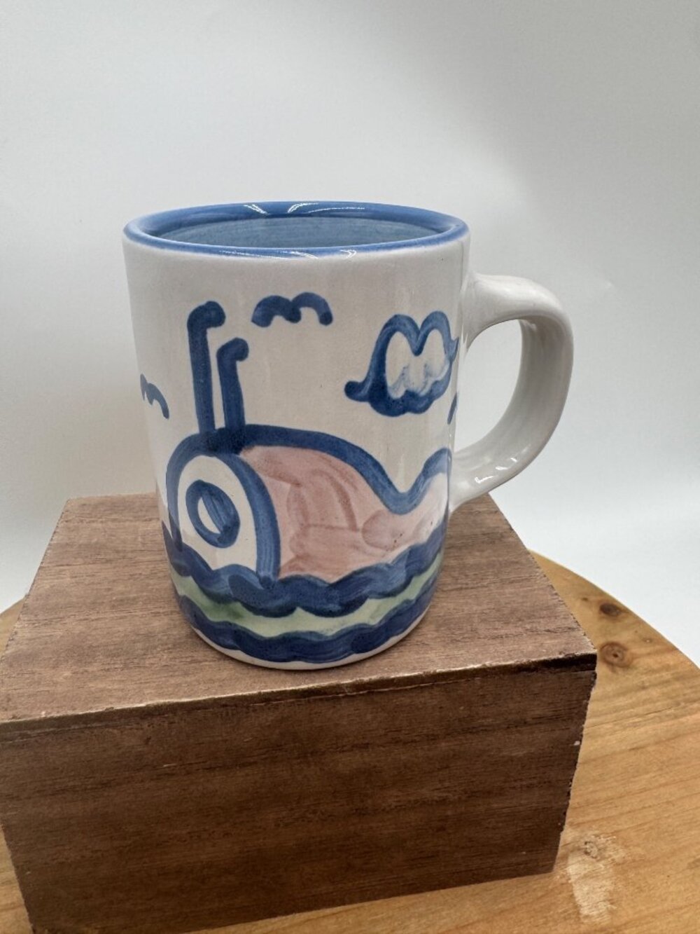 M.A. Hadley art pottery straight mug, hand-painted with a whale design Low tide